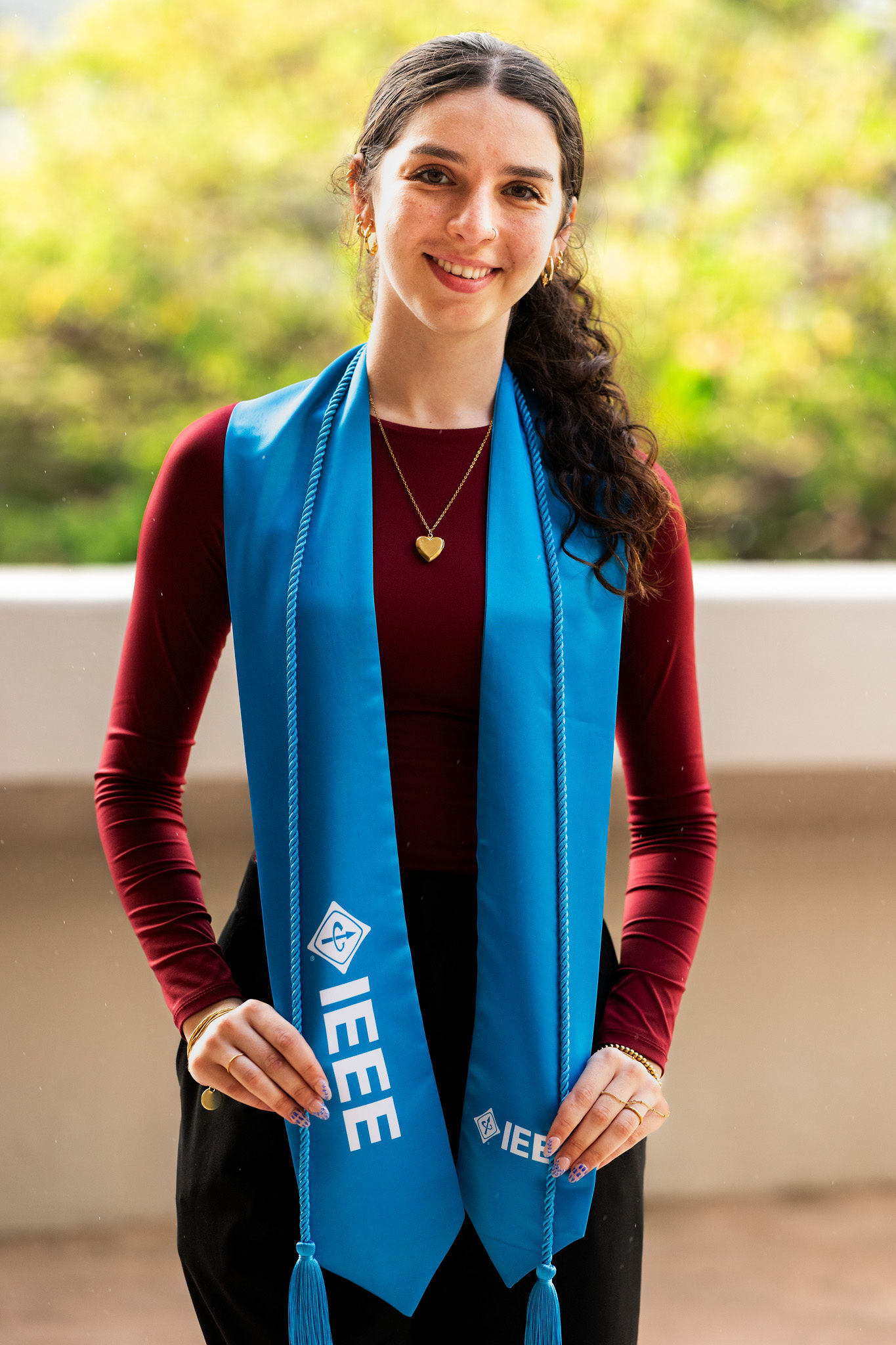 IEEE graduates wearing blue IEEE graduation regalia